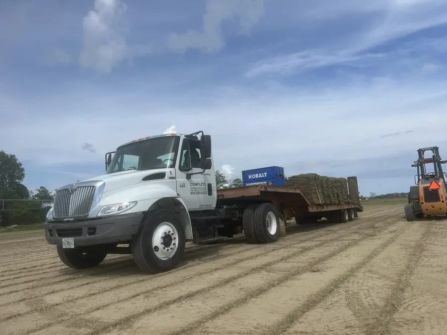 Company truck with trailer on a job site